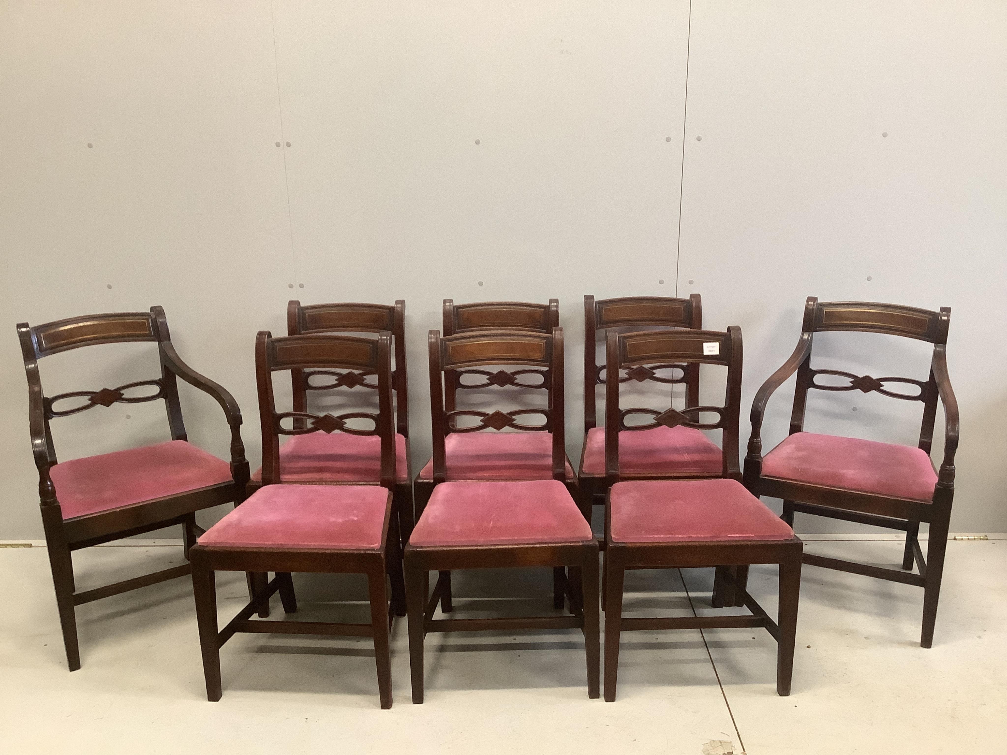 A set of eight Regency mahogany brass inlaid dining chairs including two with arms. Condition - fair